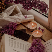 Load image into Gallery viewer, calming scene of books, candles, and lilacs
