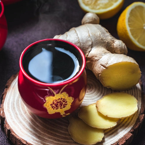 cup of ginger tea and lemon