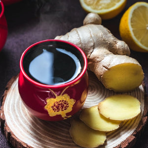 cup of ginger tea and lemon
